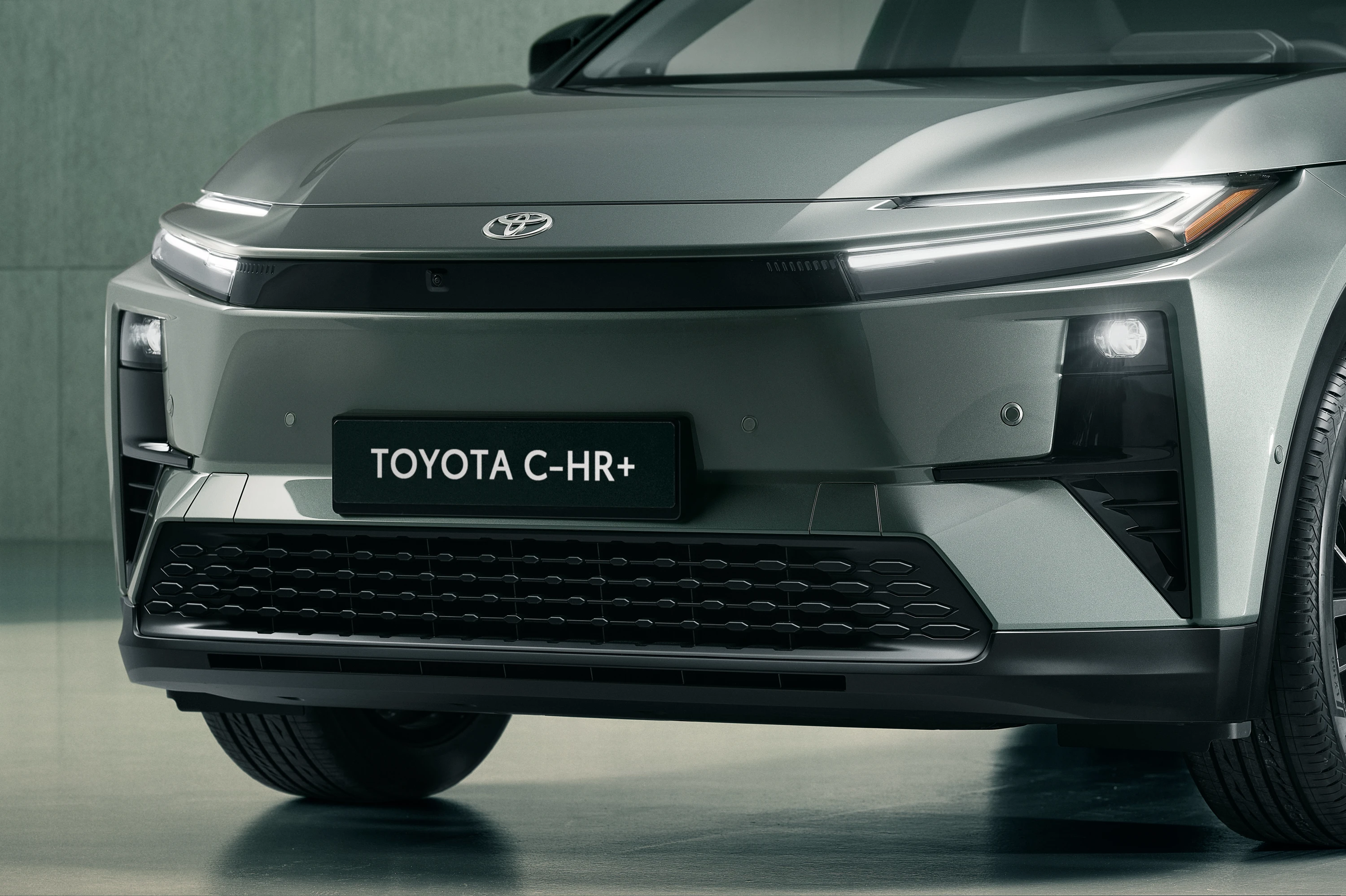 Toyota C-HR+ 77 kWh AWD headlights view